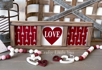 Unfinished kit measures apx. 15.5” x 5.5” and includes wooden Mdf
•backing piece 
• white vinyl arrows and square with heart
