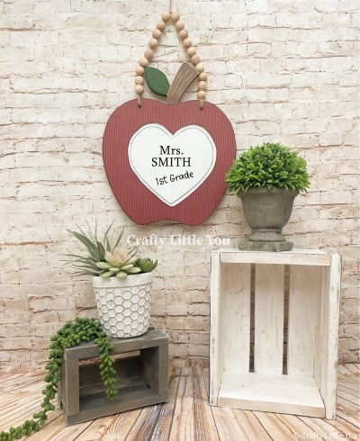 Unfinished apple measures 12” tall and includes wooden MDF 
•grooved Apple 
•black vinyl with your teachers name and grade 