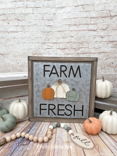 Unfinished kit measures apx. 12x12” and includes wooden MDF 
•plaque with grooves for frame and farm fresh words
•3 pumpkin overlays 
