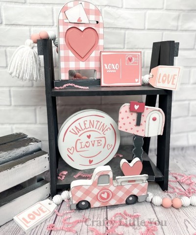 Unfinished kit includes: 
* 1 mailbox with grooved heart
* 1 postcard
* 1 round stamp sign 
* 1 mailbox with flag overlay
* 1 base for mailbox 
* 1 old truck with overlay 
* white vinyl (some is stencil) 