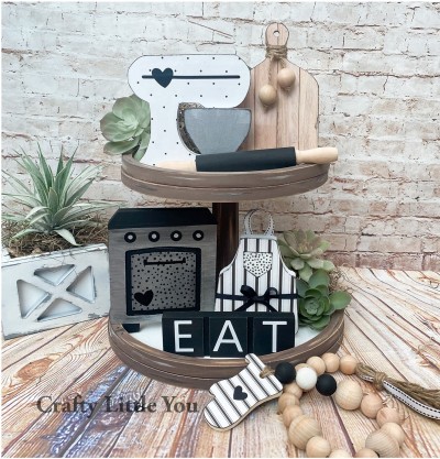 Unfinished kit measures apx. 6" tall on the charcuterie board and includes: 
* 1 mixer with bowl
* 1 charcuterie board
* 1 oven
* 1 apron
* 1 tile word sign
* Black & white vinyl