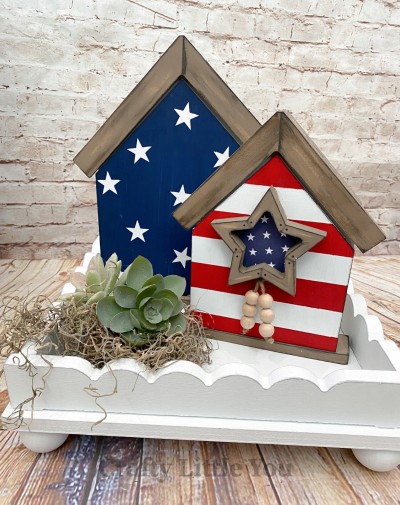 Unfinished kit measures apx. 8"x6.25" and includes wooden MDF: 
* 2 house overlay pieces
* 1 star overlay
* 2 Velcro pieces
* White vinyl stars