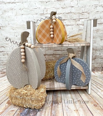 Unfinished kit measures apx. 8.25" on the tallest pumpkins and includes wooden MDF: 
* 3 pumpkins