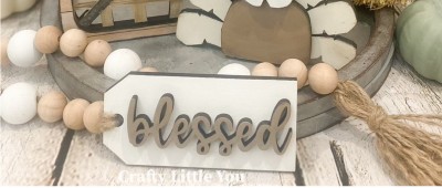 Unfinished kit measures apx. 4.75"x2" and includes wooden MDF: 
* 1 tag 
* 1 wood "blessed" word