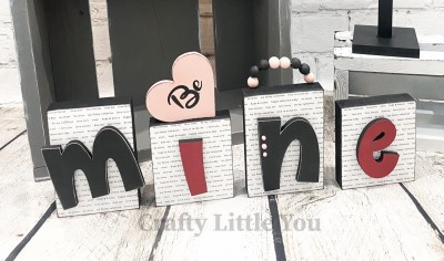Unfinished kit measures apx. 6" tall on the biggest block and includes wooden MDF: 
*4 wood blocks, 
*"Mine" overlay wood letters
* 1 heart
* Black vinyl 