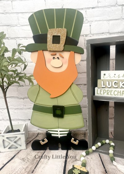 Unfinished kit measures apx. 10.5"x26" and includes wooden MDF: 
* 1 leprechaun main piece with grooves
* 1 hat brim
* 1 large belt buckle
* 1 beard
* 1 nose with connected eyes
* 2 eyebrows
* 1 medium belt buckle
* 2 small shoe half buckles