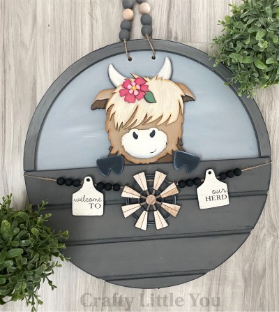 Unfinished kit measures apx. 7.5" tall and includes wooden MDF:
* 1 cow main piece with attached horns
* 1 forehead hair overlay
* 1 snout overlay
* 2 hoof overlays
* 1 flower and leaf overlay
* 1 center flower overlay
* 2 ear tags
* 1 windmill
* Black vinyl
* 2 pieces Velcro