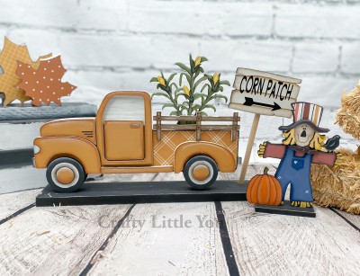 Unfinished kit includes wooden MDF:
*1 sitting corn stalk
*4 corn cob overlays
*1 scarecrow
*1 hat brim, hair, and scarf overlay
*1 pumpkin
*1 base
*1 dowel and sign
*Black Vinyl