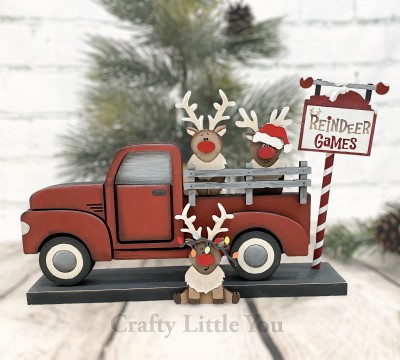 Unfinished kit includes wooden MDF:
*3 reindeer (2 standing, 1 sitting)
*3 nose overlays
*3 chest fur overlays (1 with connected legs)
*1 Santa hat overlay
*1 set of Christmas lights overlay
*1 Reindeer Games sign
*1 dowel
*Vinyl stencil