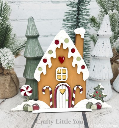 Unfinished kit measures apx. 8" and includes wooden MDF:
*1 gingerbread house main piece
*1 roof overlay with pop-out dots
*1 chimney snow overlay
*1 window
*1 door
*2 candy canes
*1 tree 
*1 peppermint swirl candy
*2 snow hill overlays
*6 gumdrops
*1 base
