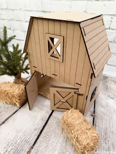 Barn measures apx. 14" tall with the base measuring apx. 12"x7.25". 
Kit includes:
*18 total wood pieces
*Assembly instructions
*Barn will come unfinished and unassembled.