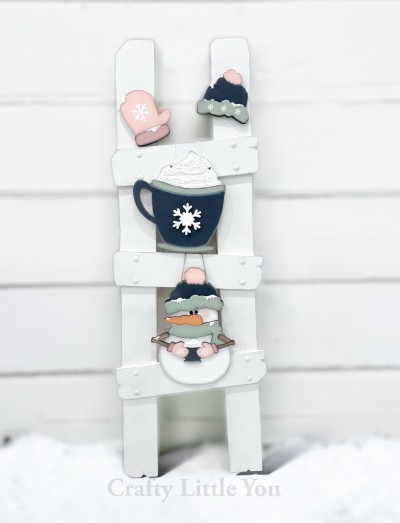 Unfinished kit measures apx. 13" tall on 
the snowman, and includes wooden MDF:
*1 hot cocoa mug with snowflake overlay
*1 snowman main piece with hat brim, scarf, nose,
cocoa mug, and arm overlays
*1 mitten with cuff overlay
*1 snow hat with brim overlay
*White vinyl
