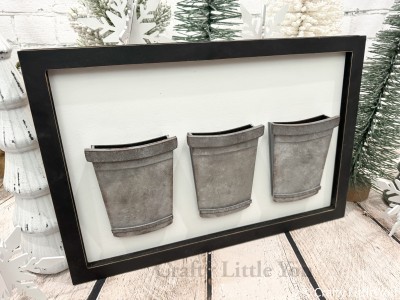 Unfinished kit measures apx.12"x18" and includes wooden MDF:
*1 main back piece
*1 frame
*3 bucket back pieces
*3 bucket front pieces
*6 bucket angled side pieces
*6 bucket rim pieces (3 large, 3 small)