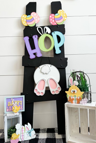 Unfinished kit measures apx. 10.5" tall on the bunny, and includes wooden MDF:
*1 set of connected “HOP” letters
*1 bunny main piece
*1 tail overlay
*2 feet overlays
*2 sets of Easter egg trios
*2 striped Easter egg overlays