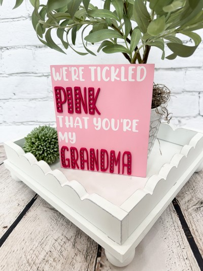Unfinished kit measures apx.  6"x7" and includes wooden MDF:
*1 sign main piece
*1 set of “PINK” and “GRANDMA” wood overlay letters
*White vinyl

*Each kit will include both “We’re” and “I’m” in white vinyl - allowing you to select the one that suits your family best!