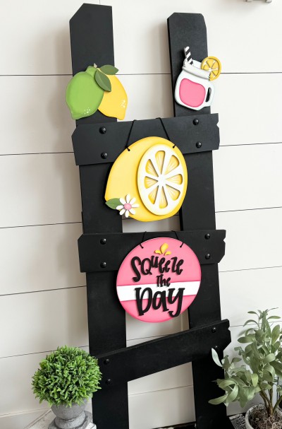 Unfinished kit measures apx. 9" tall on the hanging pieces, and includes wooden MDF:
*1 lemon with rind overlay
*1 flower with center overlay
*1 hanging circle
*1 set of “Squeeze The Day” wood overlay letters 
*1 lemon and lime with leaf overlay
*1 mason jar with lemon slice and rim overlay