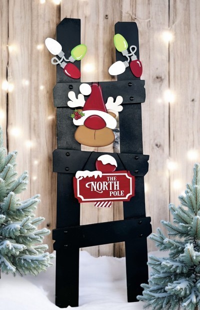 Unfinished kit measures apx. 8" tall hanging pieces and includes wooden MDF: *2 Light sets *1 Reindeer, hat, nose, holly, berries, and snow *1 North Pole sign *2 Snow pieces *North Pole Laser Letters *Outline Overlay