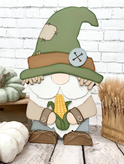 Unfinished kit made to fit the
Homie the Gnomie base kit and includes wooden MDF:
*1 Scarecrow hat
*1 hat brim overlay with connected straw
*1 set of arms with connected corn
*1 large button overlay
*2 small button overlays
*2 pant legs
*8 dot Velcros