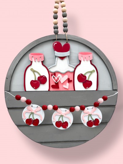 Unfinished kit measures apx. 7" tall and includes wooden MDF: *1 bottle main piece *3 set of outside bottle and lid overlays *2 cherry bundles for bottles
*6 hearts for potion bottle *3 circles with holes
*3 cherries with bows *2 velcro pieces