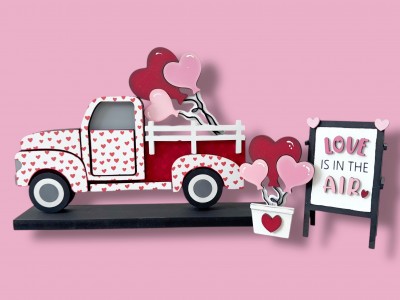 Unfinished kit measures apx. 5"x3" on sign and includes wooden MDF: *1 easel with “love, air” wood letters & “Is in the” Black vinyl *1 set of 3 balloons for truck bed *1 set of 3 balloons in bucket with heart