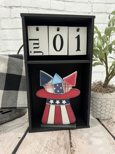 Unfinished kit measures apx. 7.25" tall and includes wooden MDF:
*1 hat
*1 hat brim overlay
*3 stars
*1 firework overlay
*3 firework top overlays
*1 base