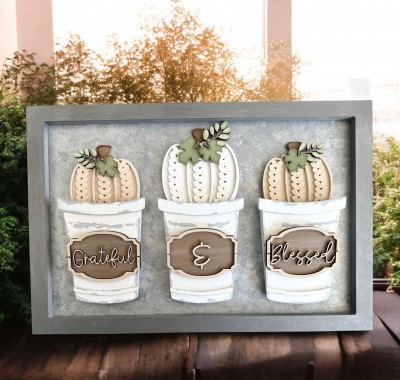 Unfinished kit measures 4.5" tall on the largest pumpkin and includes wooden MDF:
*3 pumpkin main pieces
*3 pumpkin sweater overlays
*4 leaves
*3 leaf sprigs
*3 hanging signs
*6 frame overlay pieces
*1 set of “Grateful & Blessed” wood overlay words
*3 Velcro dots